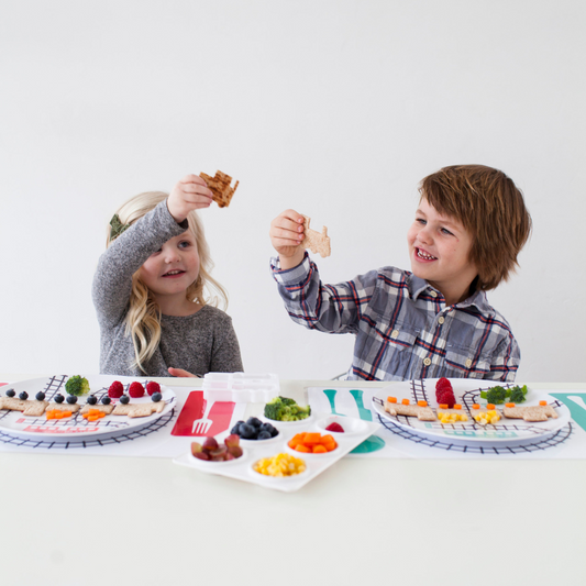Boy and Girl decorating their Dylbug Personalized Little Me Dress up Plates for fun at mealtime, even for picky eaters