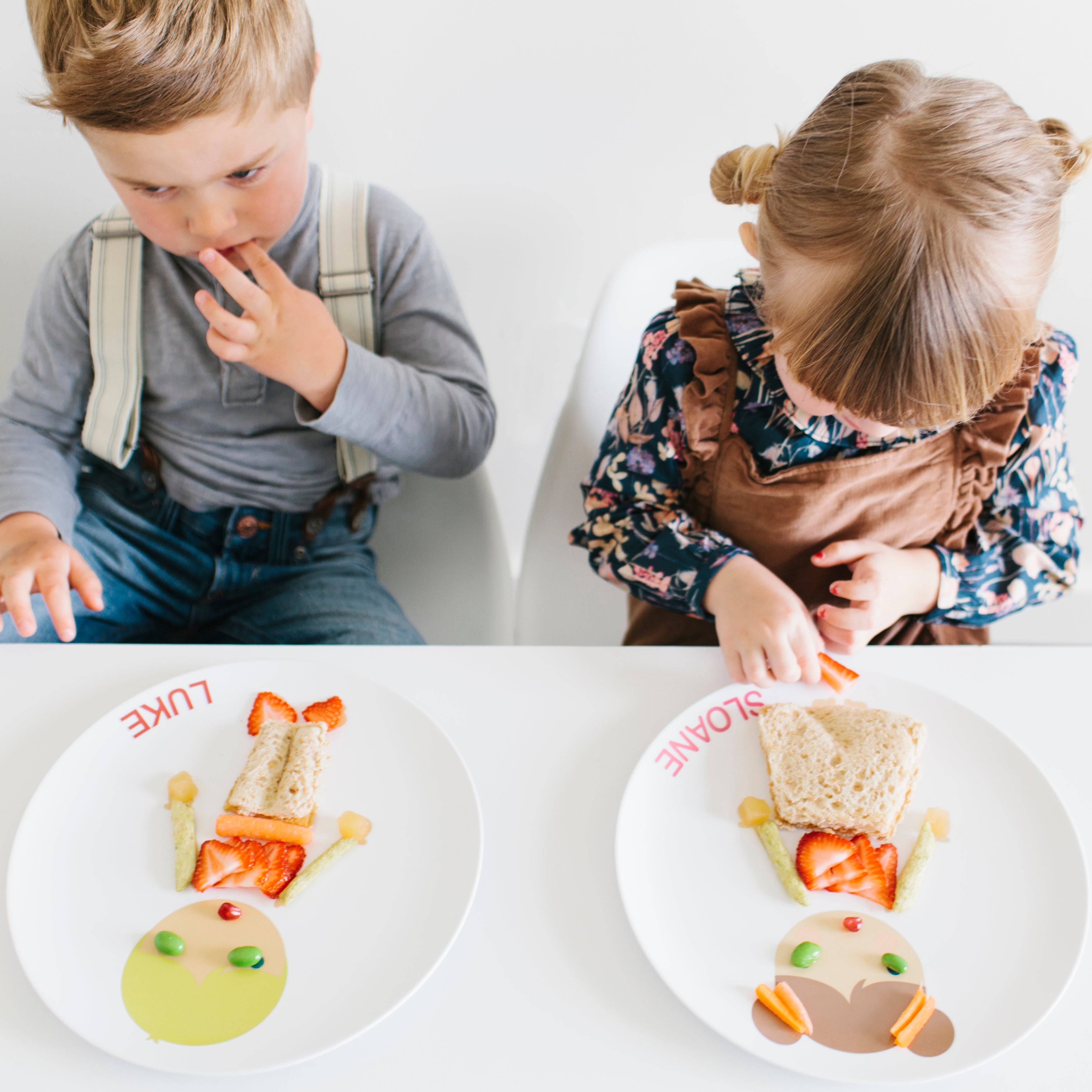 Boy and Girl decorating their Dylbug Personalized Little Me Dress up Plates for fun at mealtime, even for picky eaters