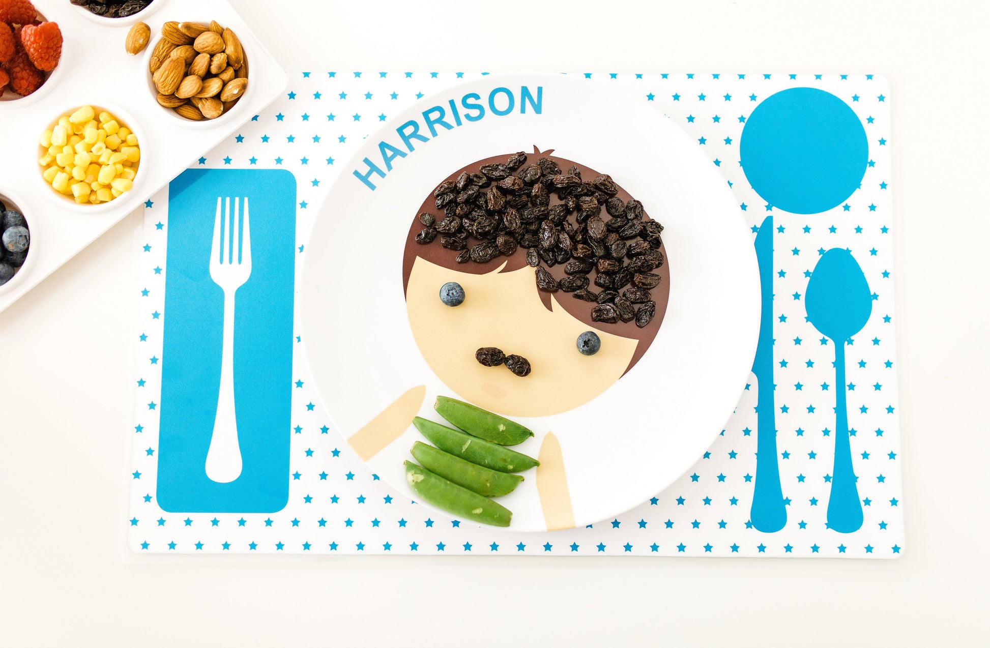 Dylbug personalized face plate and placemat in blue with fun food faces makign meal times fun.