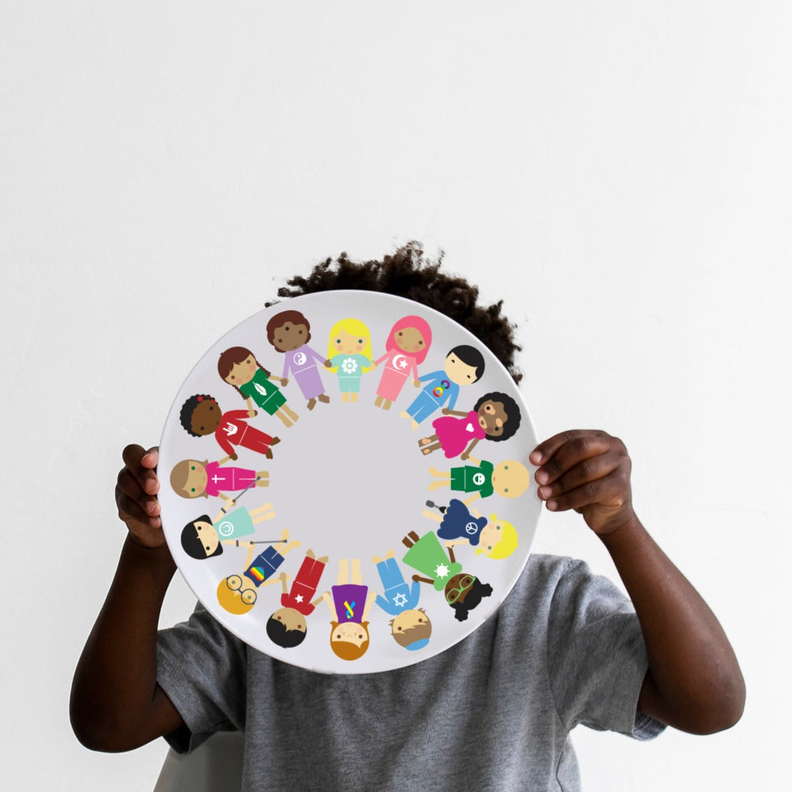 Little Boy holding his harmony plate.