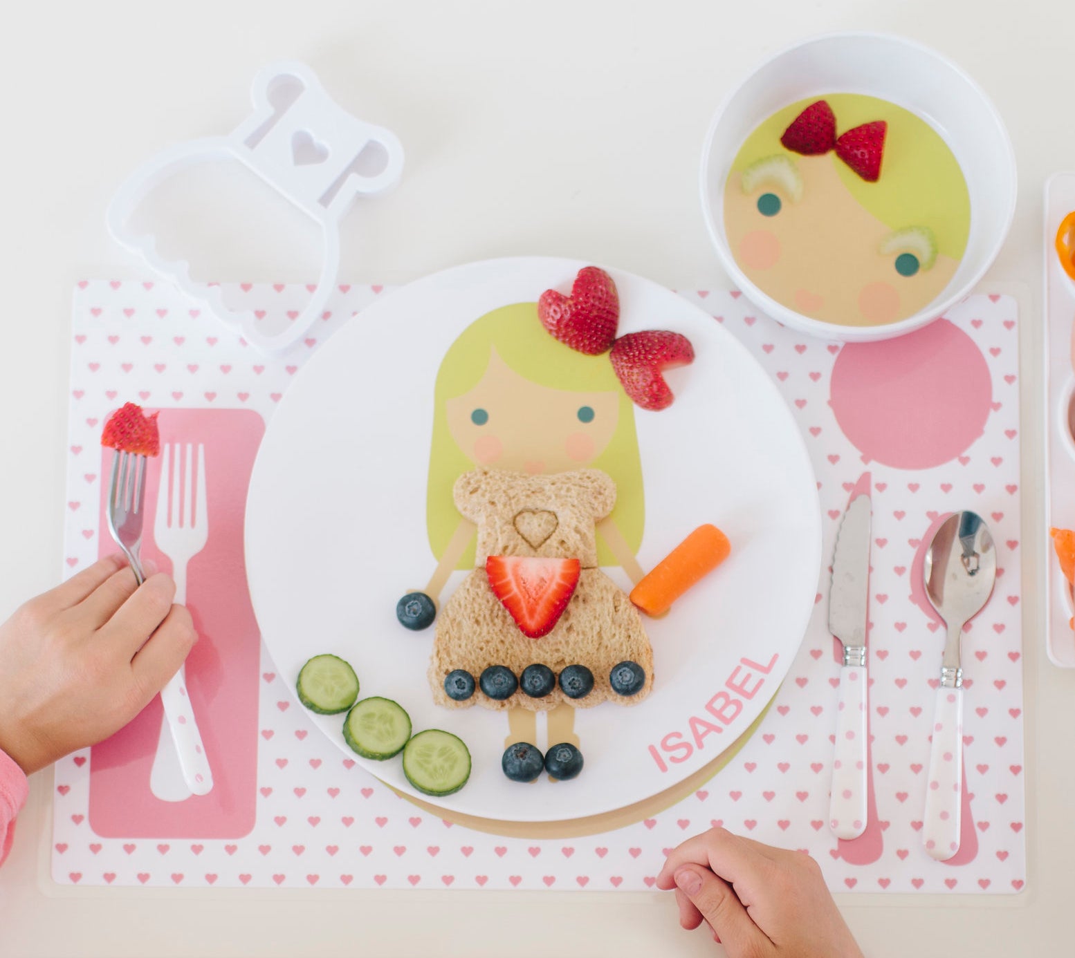 Little Girl decorating their Dylbug Personalized Little Me Dress up Plates for fun at mealtime, even for picky eaters