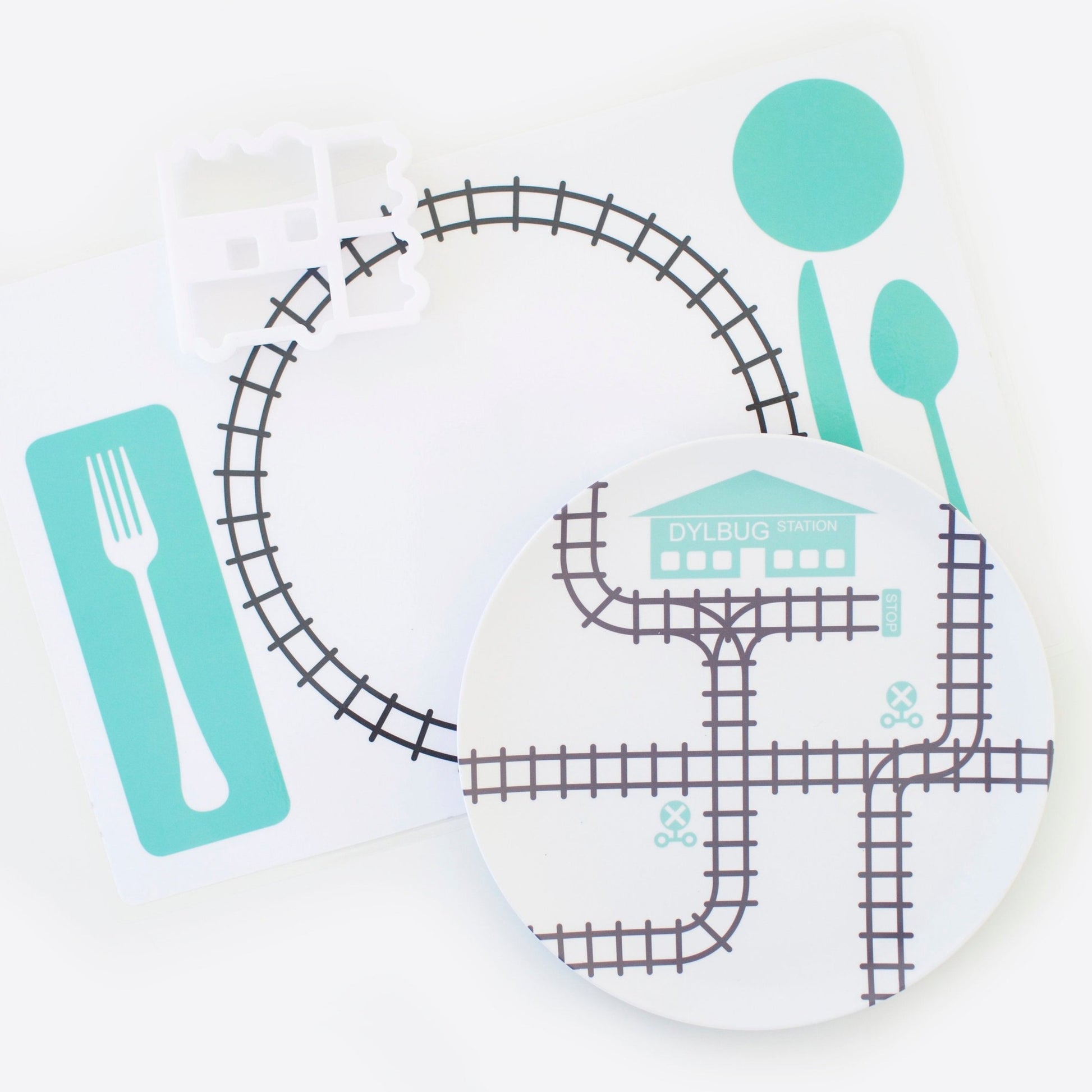 Dylbug Personalized Train Plate with placemat for Kids in teal. Perfect to keep active kids and picky eaters happy at meal time.