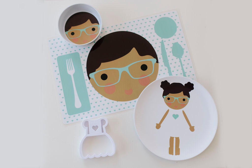 Dylbug personalized little me girl dish set in teal. Including placemat, plate, bowl and food cutter. Customize skin tone, hair color, hair style, eye color,  add glasses and freckles.
