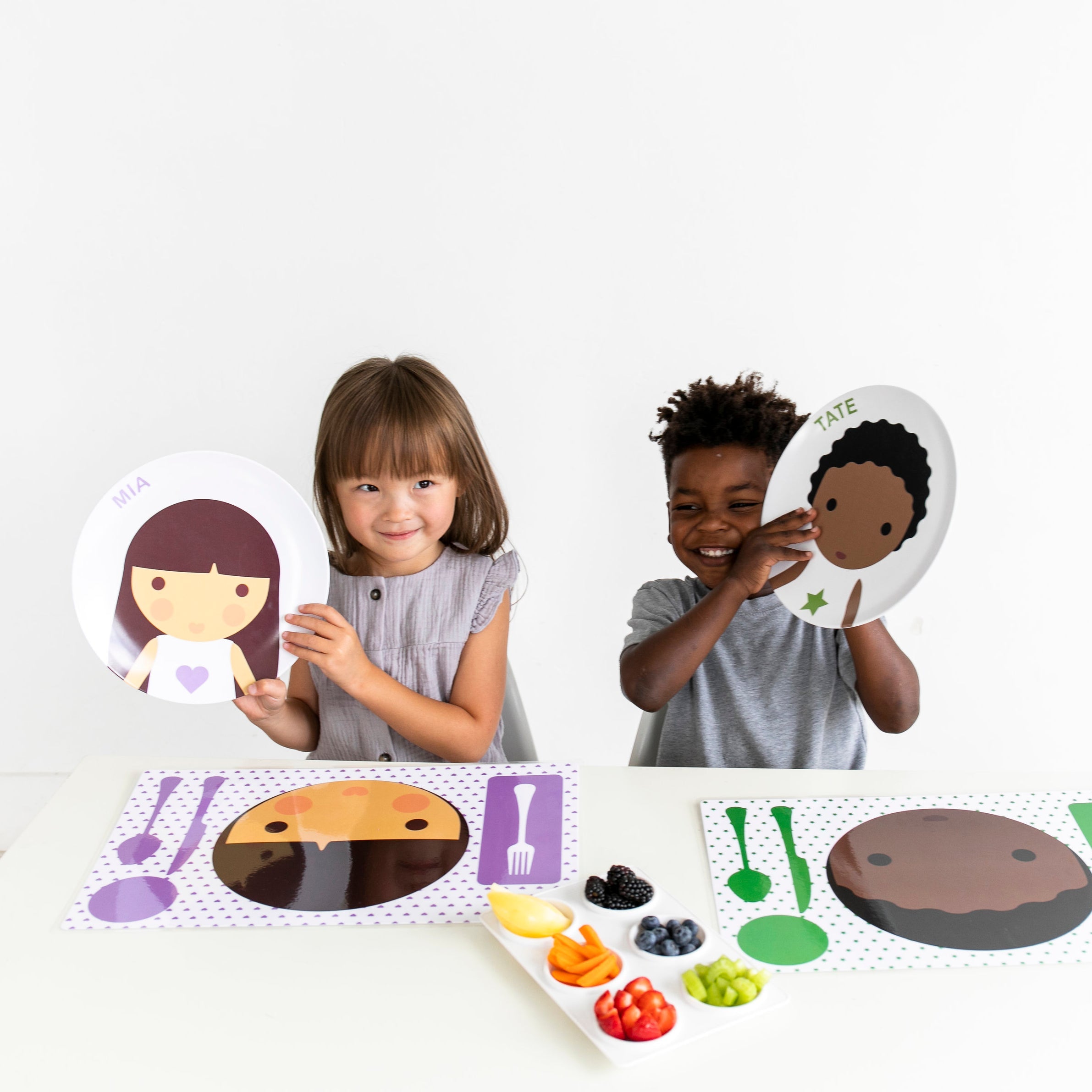 Kids decorating their Dylbug Personalized Little Me Face and Dress up Plates for fun at mealtime, even for picky eaters