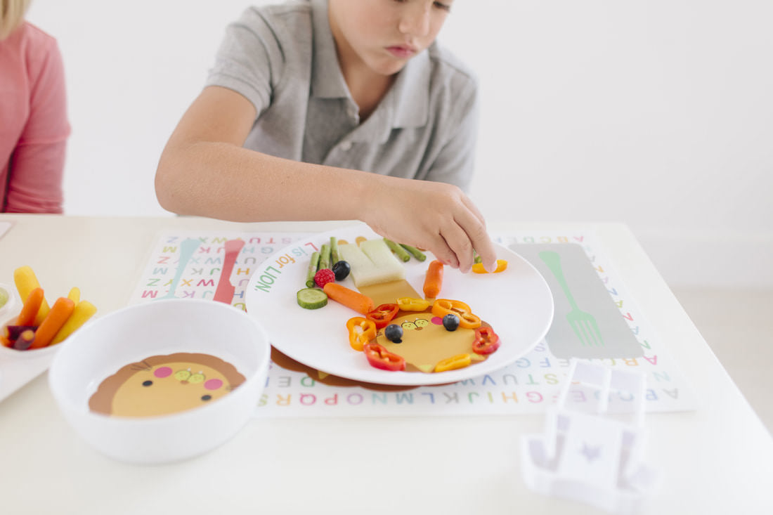 kids dressing up their custom Dylbug Lion plate and placemat with fun food fashion
